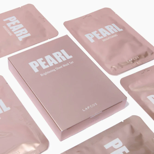Pink 'Pearl' face mask packaging with visible branding on a white background