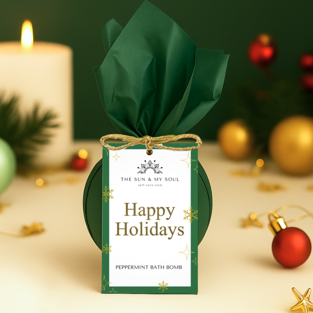 Peppermint bath bomb with green tissue paper and 'Happy Holidays' tag on a festive background.