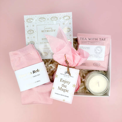 Gift set with pink items on a pink background