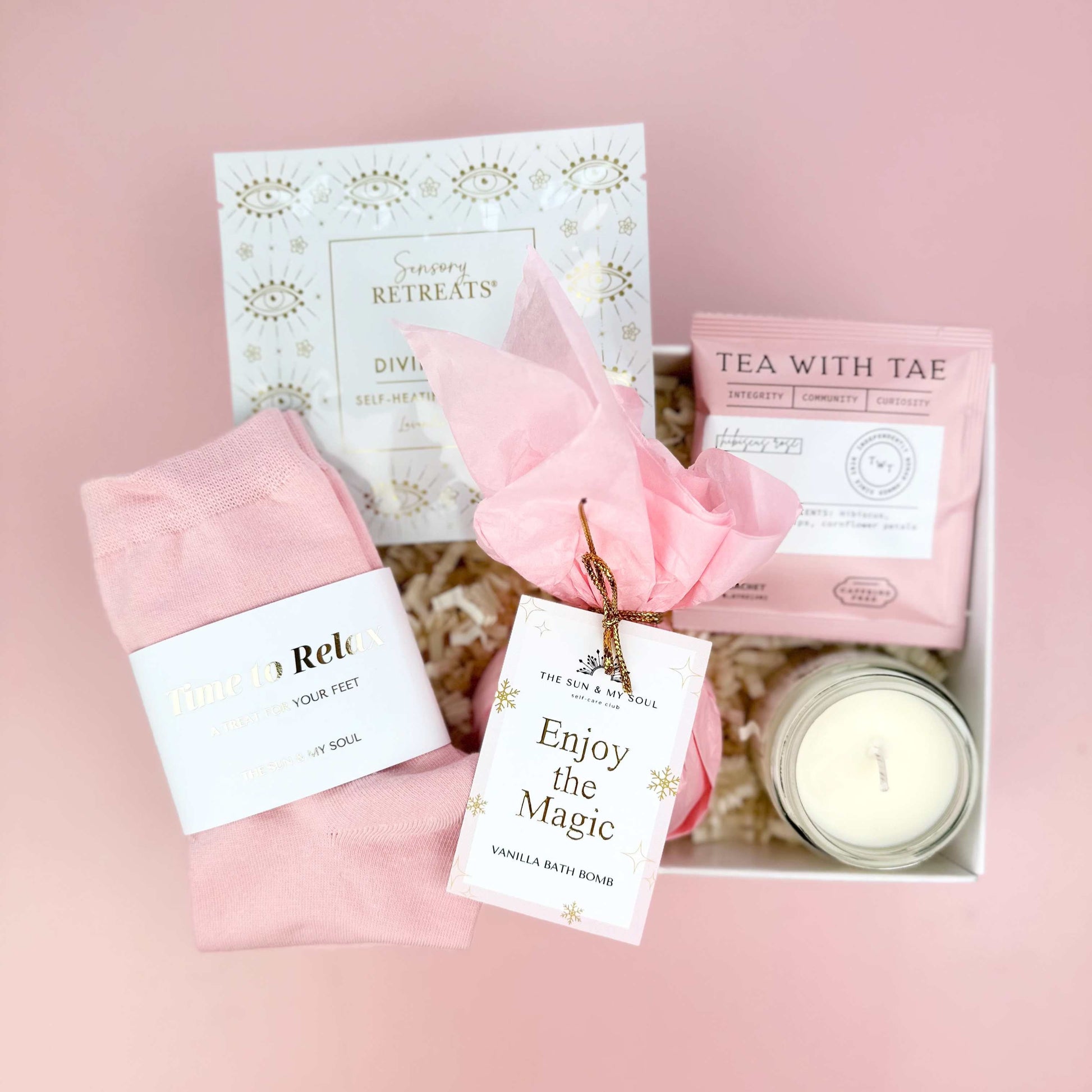 Christmas Gift set with pink items on a pink background