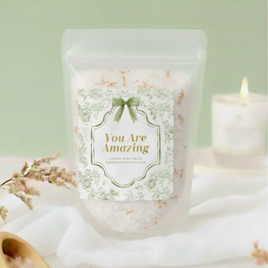 Packaged product labeled 'You Are Amazing' with a candle and decorative elements on a light green background