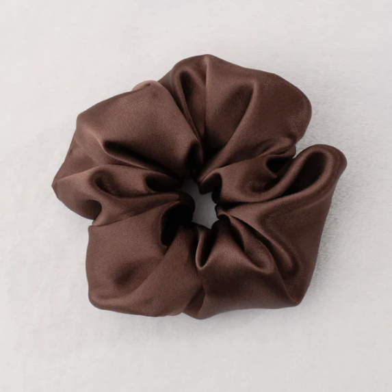 Brown scrunchie on a light gray background