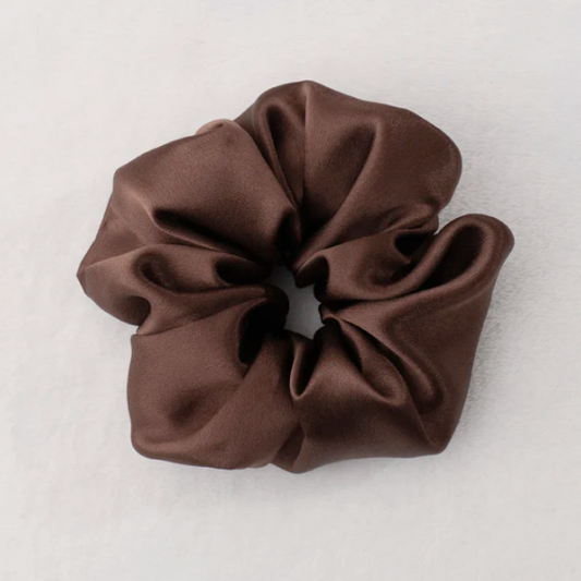 Brown scrunchie on a light gray background