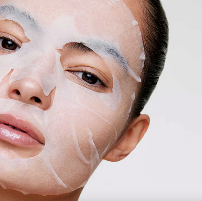 Person wearing a face mask with a neutral background