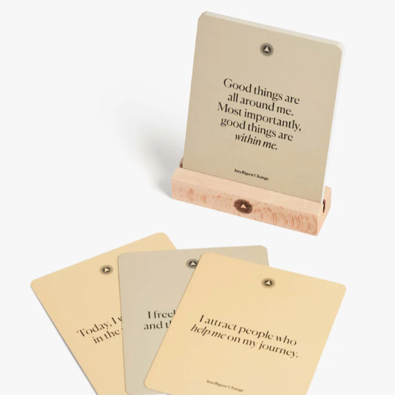 Set of motivational cards with wooden holder on a white background
